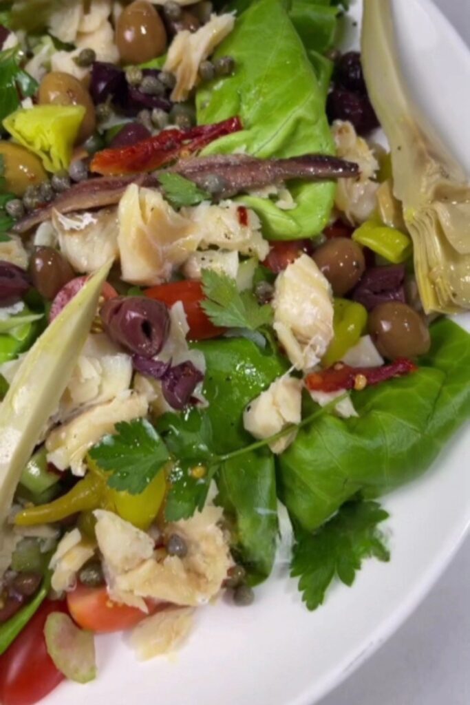 Giada De Laurentiis Baccala Salad with olives, artichokes, and fresh greens.