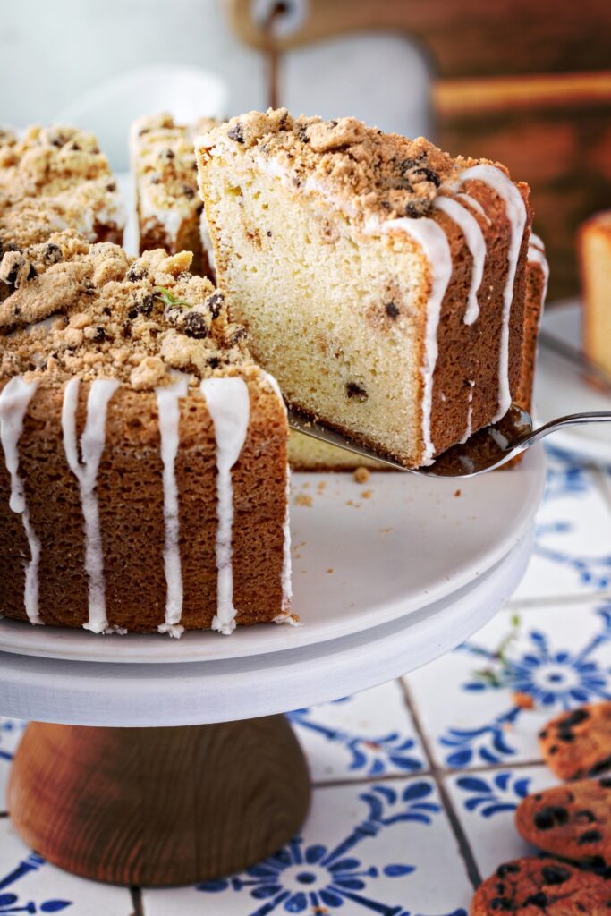 a slice of Giada De Laurentiis chocolate chip pound cake being lifted from the cake.