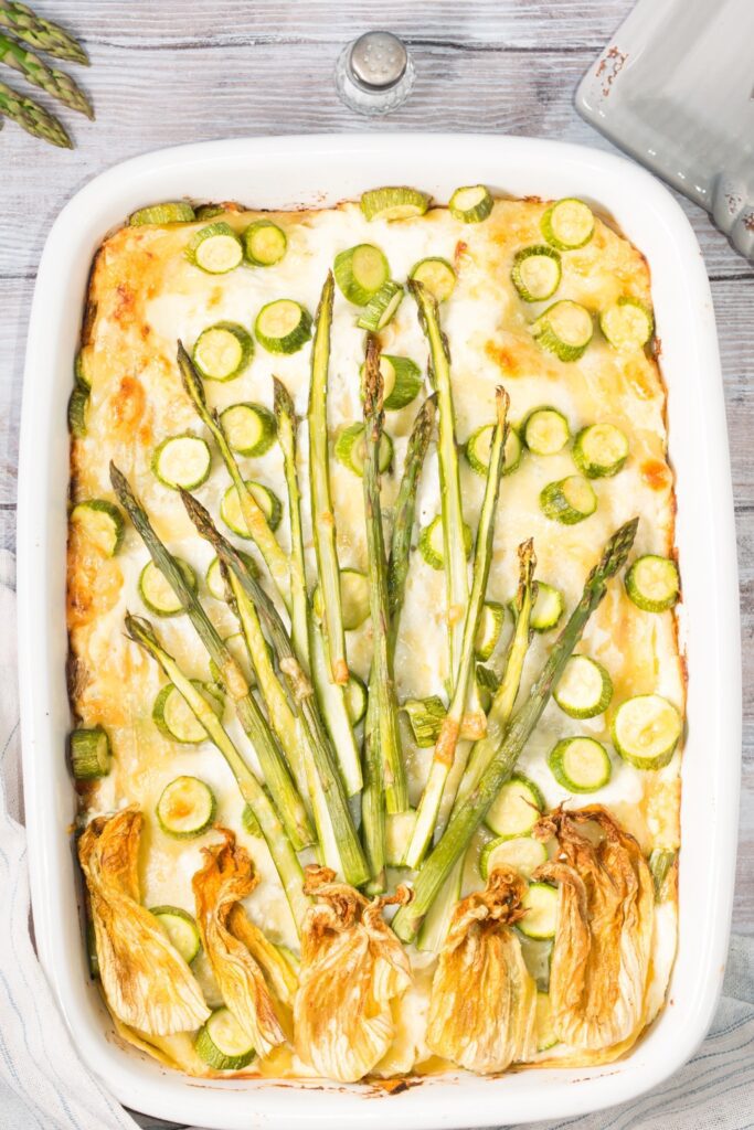 Baking dish with asparagus and zucchini lasagna.