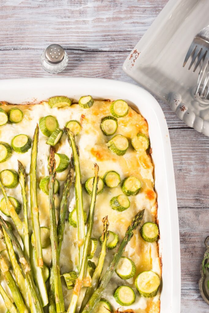 Top view of asparagus lasagna in a baking dish.