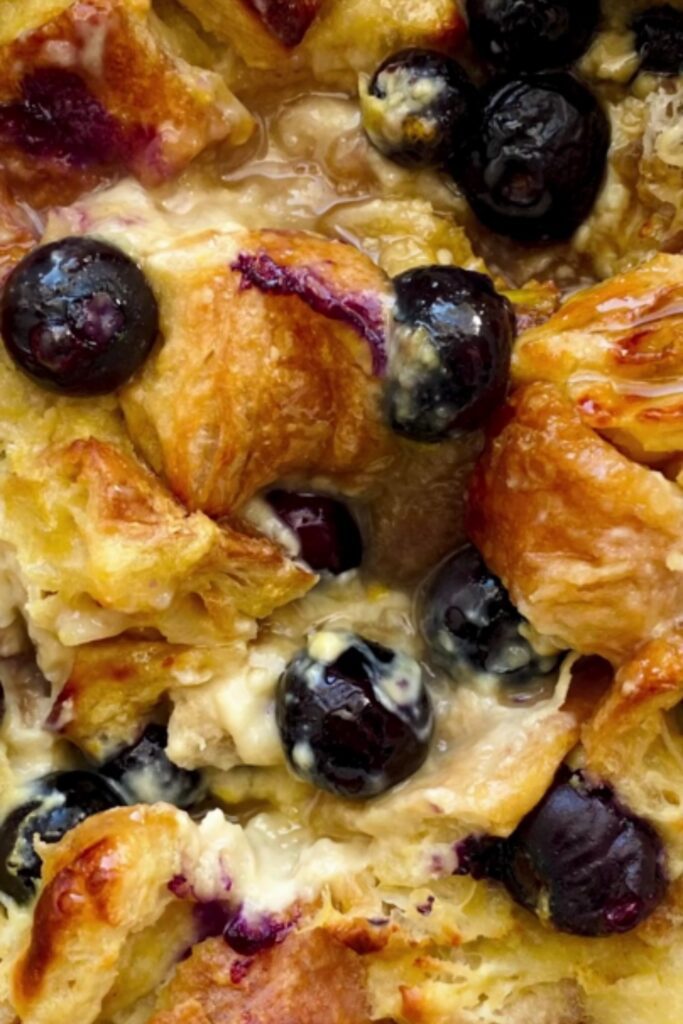 Giada Baked Blueberry French Toast Casserole with golden croissants and fresh blueberries.